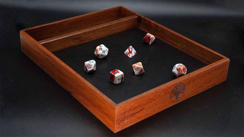 Jarrah dice tray with black leather lining rolling space. Gloss polish finish. Dark luxurious wood.