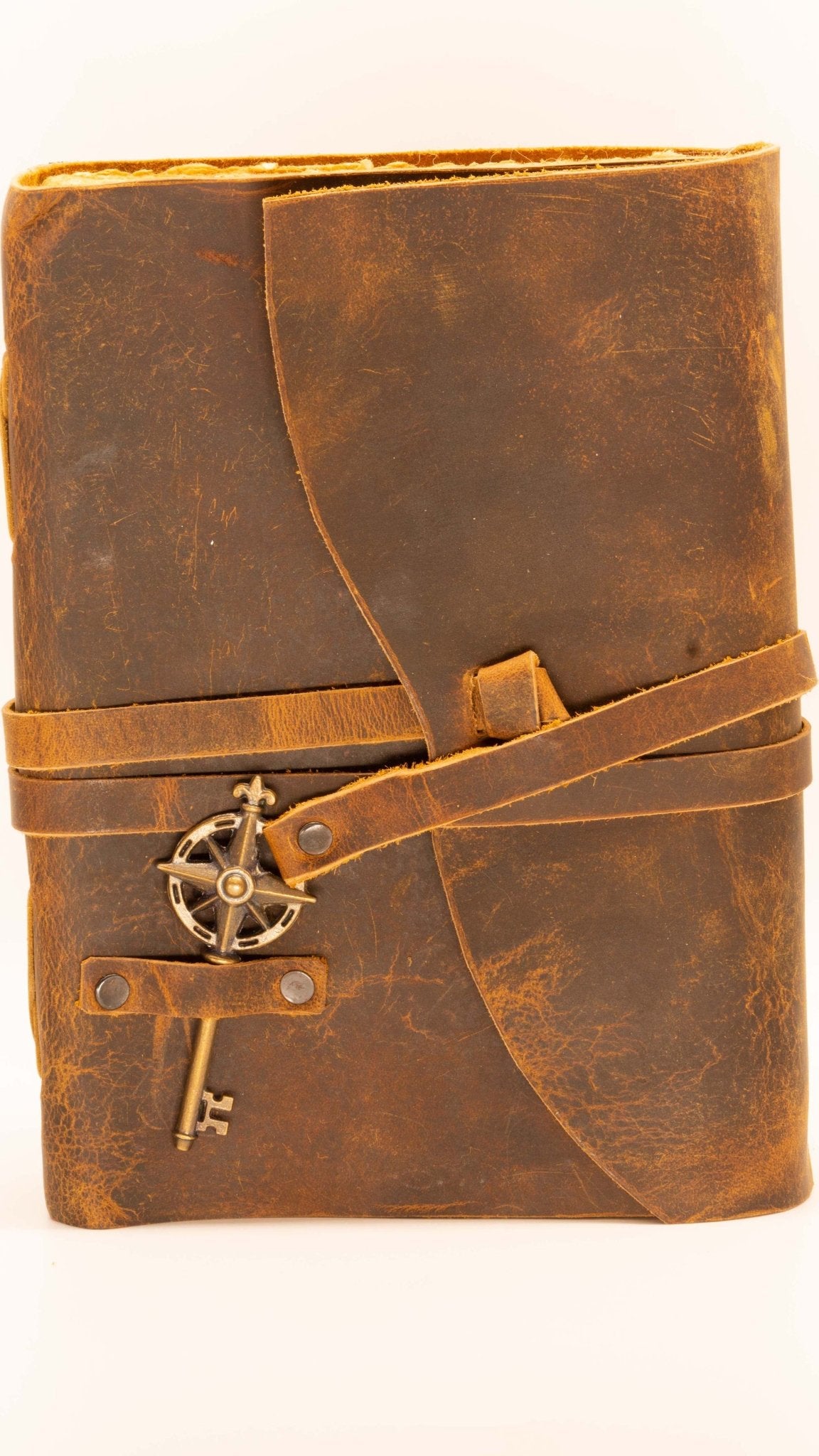Leather journal for your adventures. Comes with leather strap and key along with deckle edged paper
