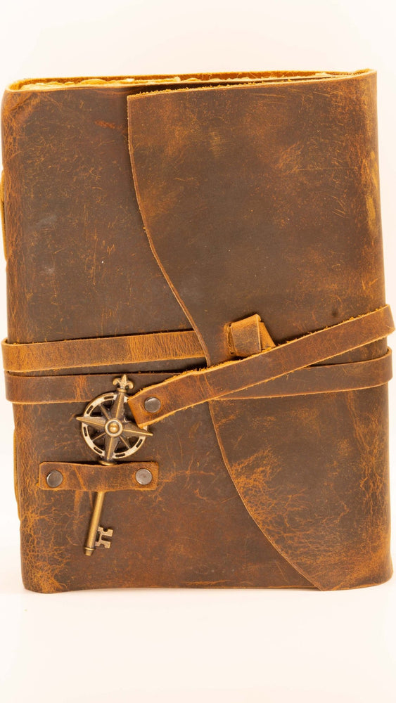 
                  
                    Leather journal for your adventures. Comes with leather strap and key along with deckle edged paper
                  
                