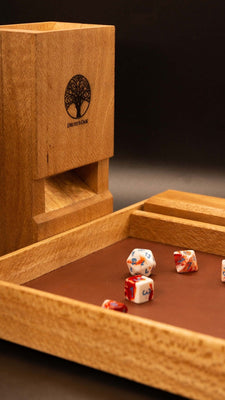 Tabletop gaming set, including a dice tower, dice case and dice rolling tray. The tower comes together with magnets and can be separated into two halves that sit neatly into the dice tray.